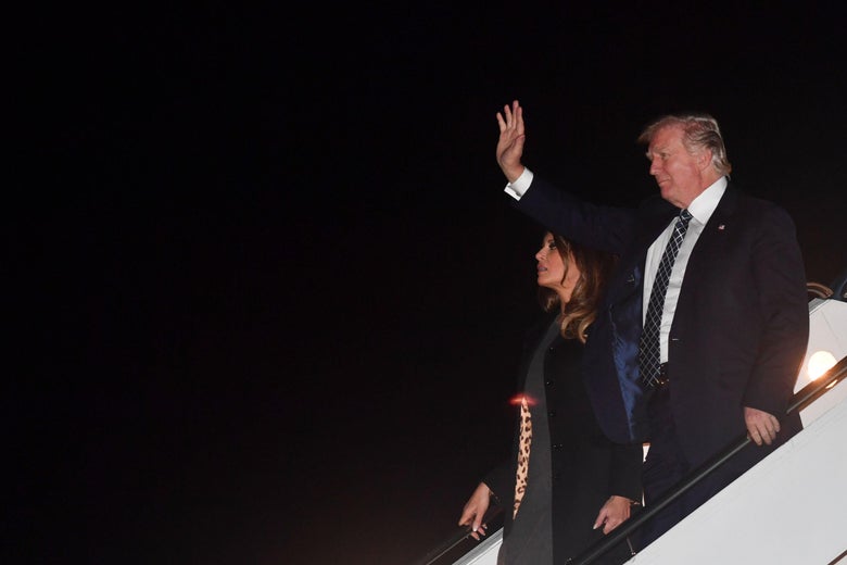President Donald Trump, and wife Melania step off Air Force One upon arrival at Palm Beach International Airport in West Palm Beach, Florida on January 12, 2018.Trump is heading to Palm Beach, Florida where he is scheduled to spend the weekend at the Mar-a-Lago estate. / AFP PHOTO / Nicholas Kamm
